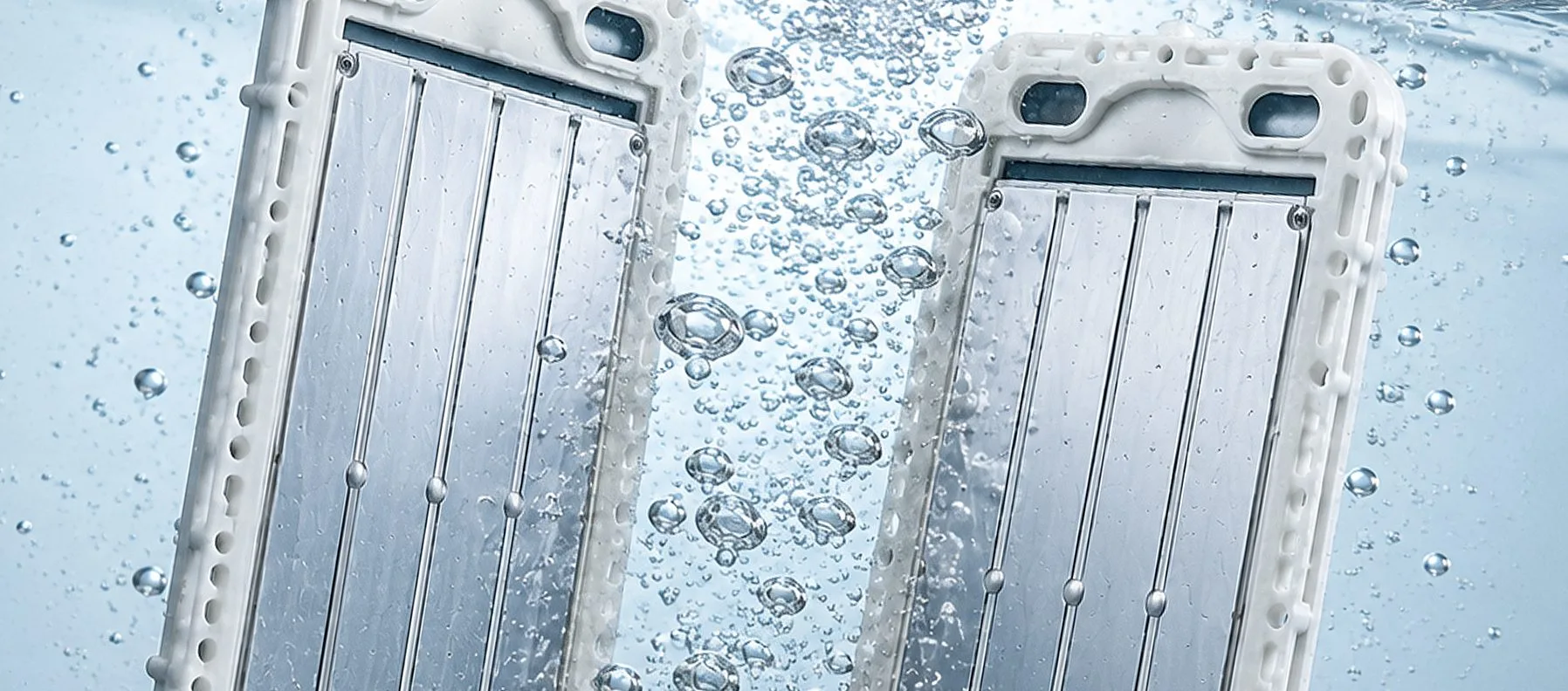 The platinum-coated titanium plates electrolyzing water, with fine bubbles rising between them